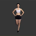 Active Woman in White Sports Bra and Black Shorts Posing with Hands on Hips