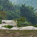 Natural Scenic Wall Surrounded by Mountains Bamboo Groves Trees Stones And Grass