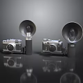 Vintage Electronic Cameras With Large Flash Units And Reflective Surfaces