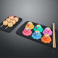 Colorful Animal Shaped Snacks Including Chicken and Octopus on Black Trays with Chopsticks