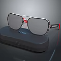 Stylish Modern Sunglasses With Silver Frame Red Accents And Gray Lenses On Black Case