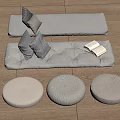 Cozy Gray Floor Seating With Throw Pillows Open Book And Round Cushions On Wooden Floor
