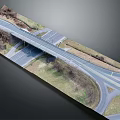 Highway Bridge Over Road Intersection With Curved Turn Lanes Grass Median And Trees