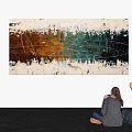 Vibrant Abstract Painting with Red Green Hues Viewed by Two People Sitting On White Wall
