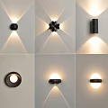Modern Wall Lamps With Various Designs And Warm Lighting Effects On White Walls