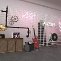 Man Sitting In Room With Guitars Records Speakers Headphones And Audio Gear
