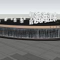 Illuminated Circular Water Fountain With Surrounding Trees And Paved Plaza Ground