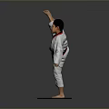 Man in White Taekwondo Uniform with Black Belt Performing High Kick on Mat