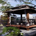 Serene Japanese Karesansui Garden Featuring Thatched Pavilion Stones Mossy Paths And Wooden Fence