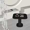 Minimalist Black Side Table With Coffee Cup And Book In Modern White Interior