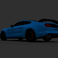 Blue Two Door Sports Car With Rear Spoiler Black Wheels And Red Brake Calipers