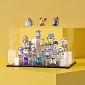 Transparent Display Case Holding Multiple Cartoon Figures With Various Designs Different Colors And Yellow Background