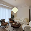 Bright Warm Stylish Living Room With Soft White Sofa Round Pendant Light And Comfortable Seating