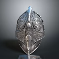 Ancient Silver Helmet With Intricate Decorative Carvings And Ornate Medieval Design