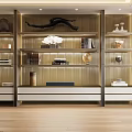 Elegant Modern Golden Bookcase with Layered Design Glass Doors and Decorative Items in Living Room