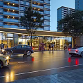 Vibrant Commercial Street With Modern High Rise Buildings Cars Pedestrians And Evening Lights