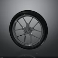 Motorcycle Black Tread Tire With Silver Spoke Wheel Rim And Glossy Reflection