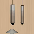 Cylindrical Glass Pendant Lights With Warm Yellow Light On Wooden Wall