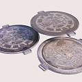 Urban Municipal Road Infrastructure Featuring Circular Patterned Metal Manhole Covers