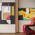 Abstract Paintings With Geometric Shapes And Vibrant Colors On Wall With Red Chair