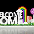 Welcome Home Sign With Rainbow Clouds And Colorful Lollipops Near Green Plants