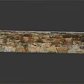 Stone Wall Structure With Snow Covered Top And Varied Colored Stone Bricks