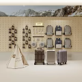 Display of Luggage and Backpacks on Wooden Pegboard with Mountain Backdrop and Canvas Tent