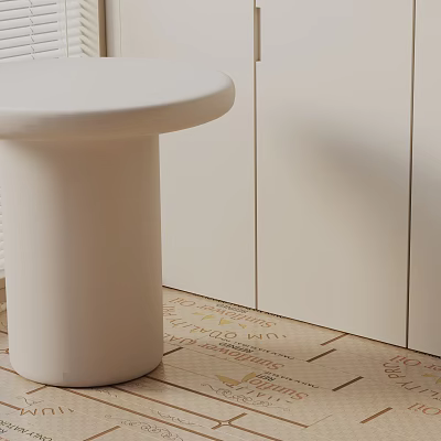Sleek White Round Side Table With Cylindrical Base Near White Cabinets And Patterned Floor 3d model