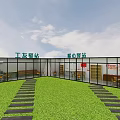 Aerial View of Enclosed Brown Area With Green Surroundings and Perimeter Fence