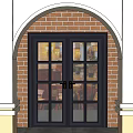 Double Doors With Glass Panes In Arched Frame Against Brick Wall Exterior