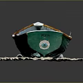 Green and White Cape Bay Model Boat Placed on Rock Base
