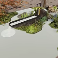 Rockery Stones With Rippling Water And Lush Green Plants In Garden