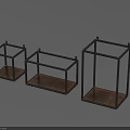 Three Dark Metal Frame Cubic Storage Racks For Home Organizing And