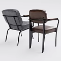 Two Stylish Leather Chairs With Brown And Gray Upholstery Black Metal Frames And Armrests
