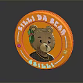 Circular Orange Daily Use Product with Bear Figure Green Bow and NINI DA BEAR Design