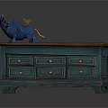 Vintage Blue Storage Cabinet With Wooden Top Multiple Drawers And Decorative Figurine