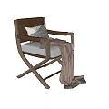 Stylish Cross Leg Wooden Frame Leisure Chair With Light Colored Cushion And Light Brown Blanket