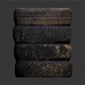 Stack of Used Car Tires with Metal Rims and Worn Tread Surface