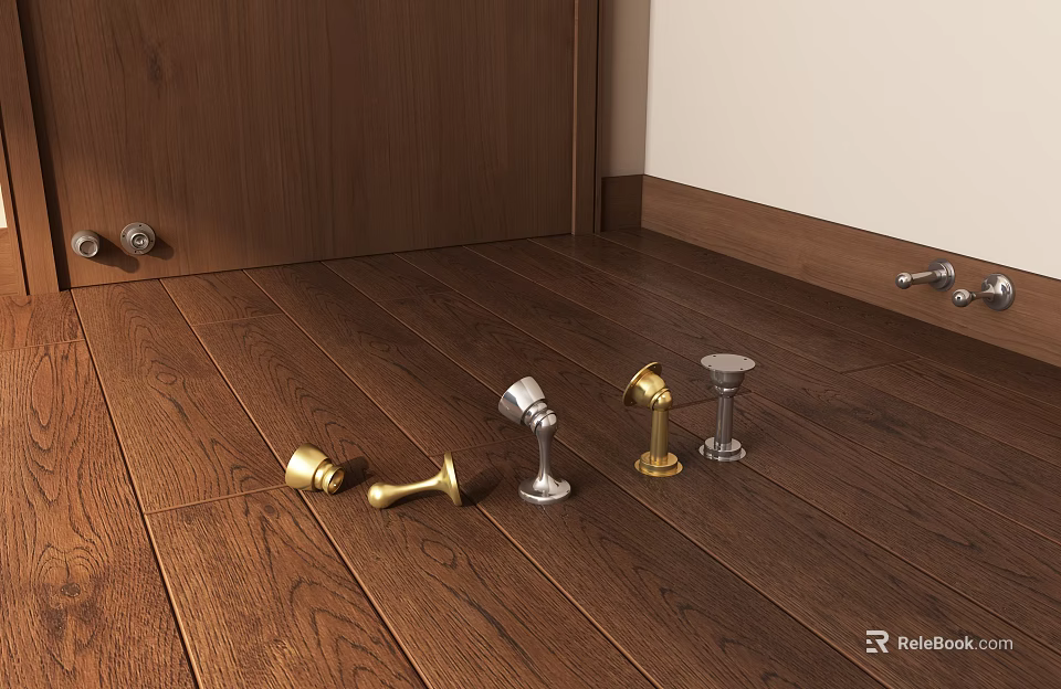 Various Metal Door Stops On Wooden Floor With Gold And Silver Finishes 3d model 