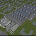 Industrial Factory Complex Aerial View With Surrounding Greenery And Parking Area