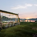 Garden Landscape With Scenic Grassland Outdoor Dining Setup Decorative Wooden Frame Hanging Lights And Sunset