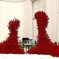 Stunning Photo Spot With Giant Red Flower Decorations Black Chair And White Walls