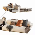 Modern Beige Sectional Sofa With Brown Orange Gray Pillows And Throw Blanket