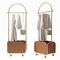 Gold Metal Clothes Rack with Brown Storage Compartment Hanging Clothes and Handbags on Wheels