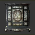 Traditional Dark Cabinet With Intricate Carved Motifs And Decorative Legs