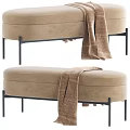 Beige Fabric Sofa Bench With Black Metal Legs And Striped Throw Blanket