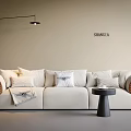 Beige Sofa Set with Plush Cushions Woven Armrests Small Round Side Table and Wall Lamp