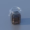 Transparent Glass Jar With Metal Clasp Containing Dark Liquid On Gray Background
