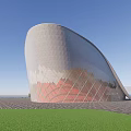 Modern Architectural Building Exterior By Waterfront With Trees And Open Sky