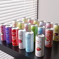 Colorful Assorted Canned BIO Beverages with Various Flavors on Table in Natural Light